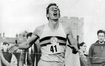 Runner crossing finish line in a race.
